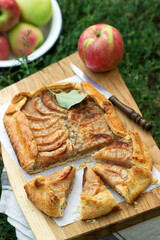Homemade apple pie with streusel and fresh fruit. Rustic style.