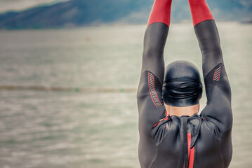 Man running triathlon on the beach