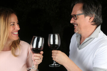 couple toast with a glass of wine