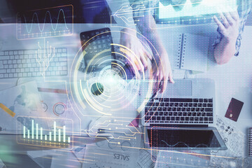 Double exposure of man and woman working together and data theme hologram drawing. Computer background. Top View.