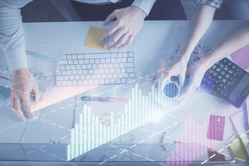 Double exposure of man and woman working together and financial chart hologram drawing. market analysis concept. Computer background. Top View.