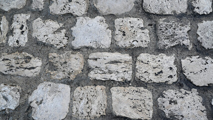 Granite natural stone floor or street as a grey paving stones blocks background