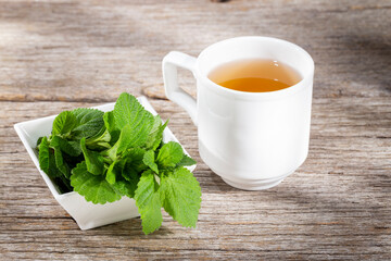 Purple sage plant and tea on the table