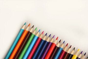 colored pencils on a white background