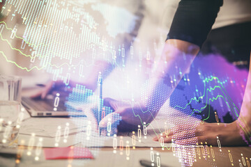 Multi exposure of woman hands typing on computer and financial chart hologram drawing. Stock market analysis concept.