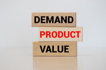 Product marketing concept. Business marketing words demand, product and value written on wooden blocks.