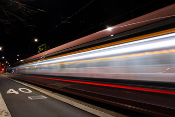 Fototapeta na wymiar Speeding tram at night