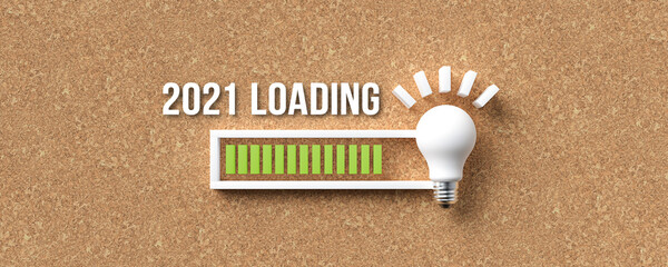 lightbulb and text 2021 LOADING with a loading bar indicator on cork background