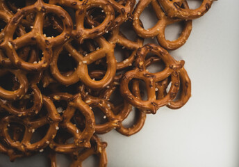 Pretzels salty snack on silver background