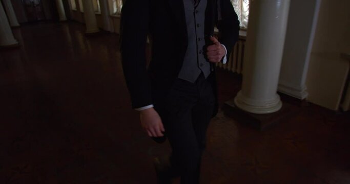 Alexander Pushkin in a suit and a top hat, with the sideburns walking, 4k