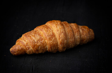home made croissant on dark table 