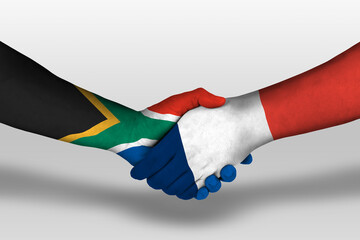 Handshake between france and south africa flags painted on hands, illustration with clipping path.