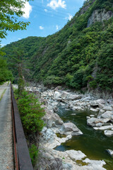 Fototapeta na wymiar Hiking on a discontinued train-line along with Muko river in Hyogo prefecture in Japan
