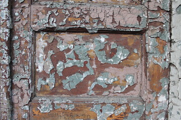 A texture of an old weathered colored door