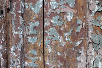 Wooden colored wall with weathered paint