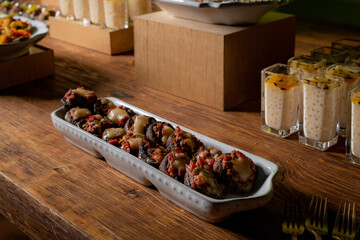 vegetarian canapes with mushrooms and cheese and tomato with dressing