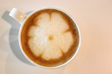 cup of hot latte art coffee