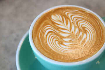 cup of hot latte art coffee