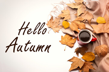 Text Hello Autumn, dry golden leaves and cup of coffee on light background, flat lay