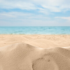 Fototapeta na wymiar Beautiful beach with golden sand near ocean, closeup view