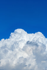 beautiful blue sky with thick white clouds in the morning vertical composition