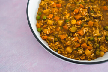 plant-based food, vegan stew with garden vegetables rice and cajun spices
