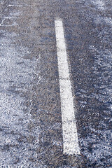 narrow winter road , closeup