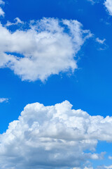 Obraz premium beautiful blue sky with white clouds in the afternoon vertical composition