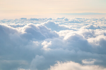 View at sunrise with puffy foggy. White puffy like cloud stretching to foggy horizon in the bright...