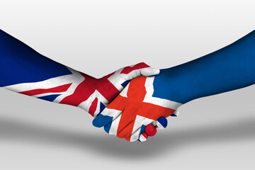 Handshake between iceland and united kingdom flags painted on hands, illustration with clipping...