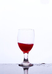 colored drink in a glass isolated white background