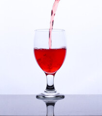 colored drink in a glass isolated white background
