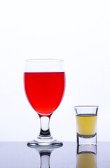 colored drink in a glass isolated white background