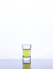 colored drink in a glass isolated white background