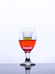 colored drink in a glass isolated white background