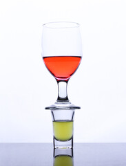 colored drink in a glass isolated white background