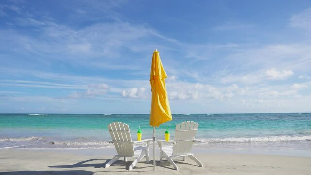 Tourist vacation on Atlantic ocean beach concept. The idea of advertising a beach resort. Beach accessories and clear Caribbean sea beach background.