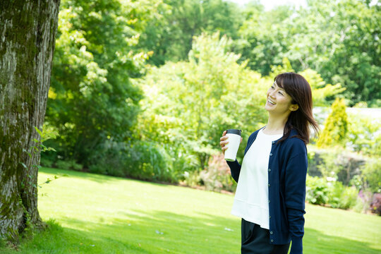 Mature Woman Walking in the Garden