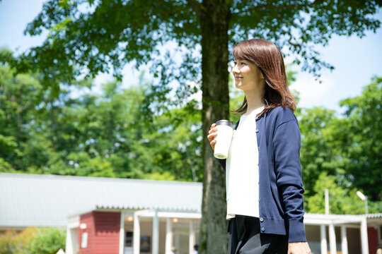 Mature Woman Walking in the Garden