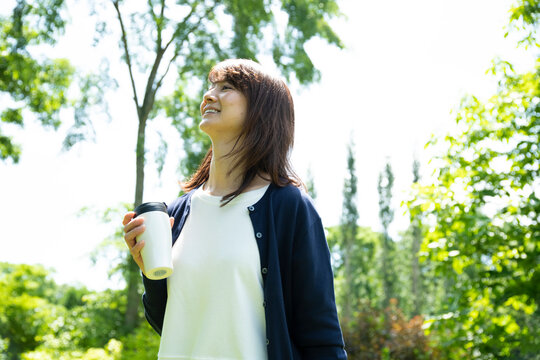 Mature Woman Walking in the Garden