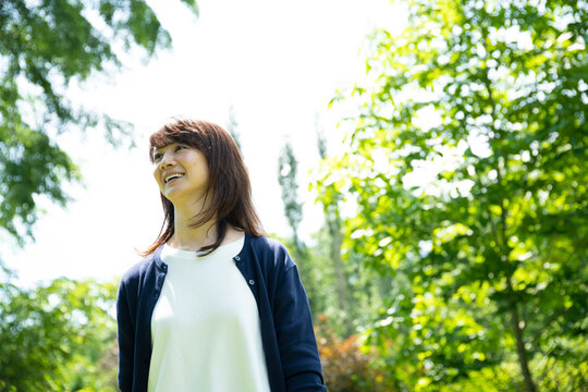 Mature Woman Walking in the Garden