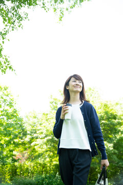 Mature Woman Walking in the Garden