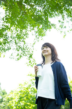 Mature Woman Walking in the Garden