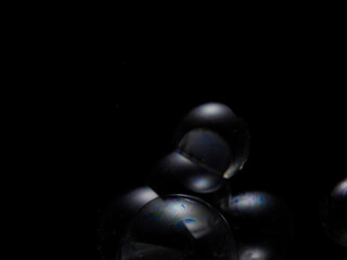 Soap bubble on black background