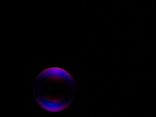 Soap bubble on black background