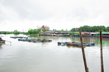 Fototapeta premium Fishing cages and boats in fishing villages
