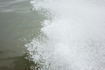Background picture of water splashing from the propeller of a motor boat.