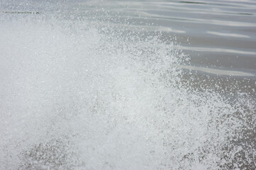 Background picture of water splashing from the propeller of a motor boat.