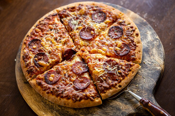 Pepperoni Pizza on the wooden board