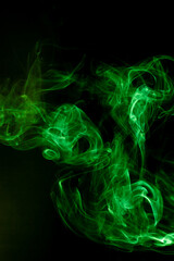 Green smoke motion on black background.